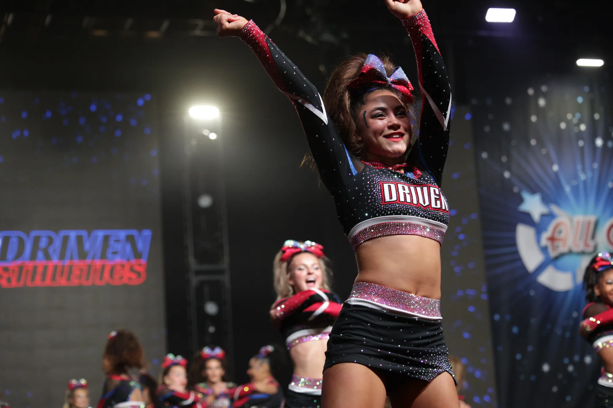 A Driven athlete celebrates after hitting a routine